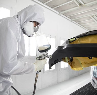 Collision Center Technician Painting a Vehicle | Fort Wayne Toyota in Fort Wayne IN