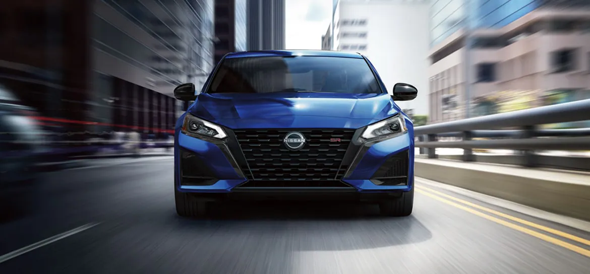 Used Nissan Altima driving in Fort Wayne